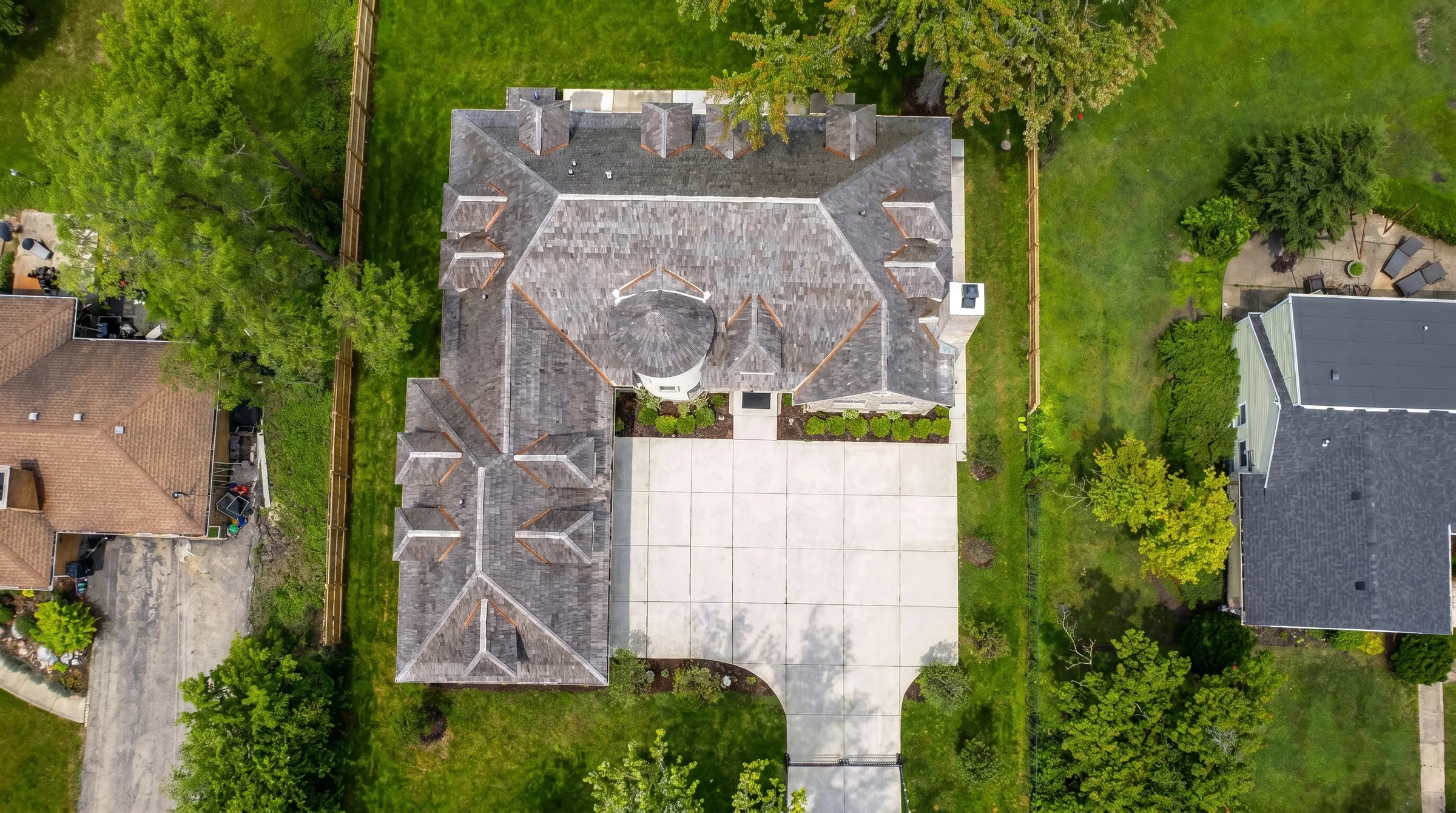 Aerial photograph directly above the finished house, matching the blueprint